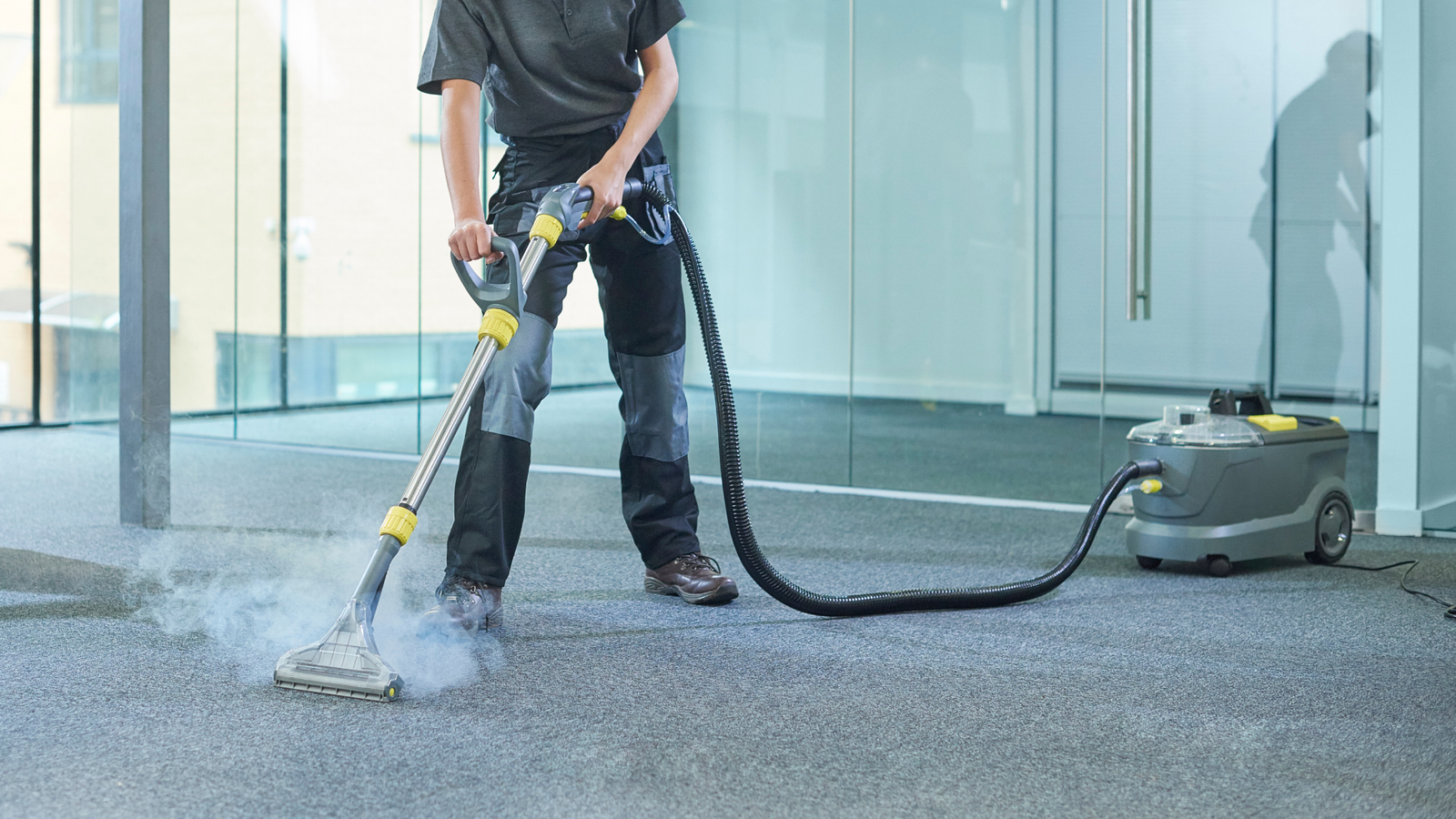 woman using machine to professionally clean floor